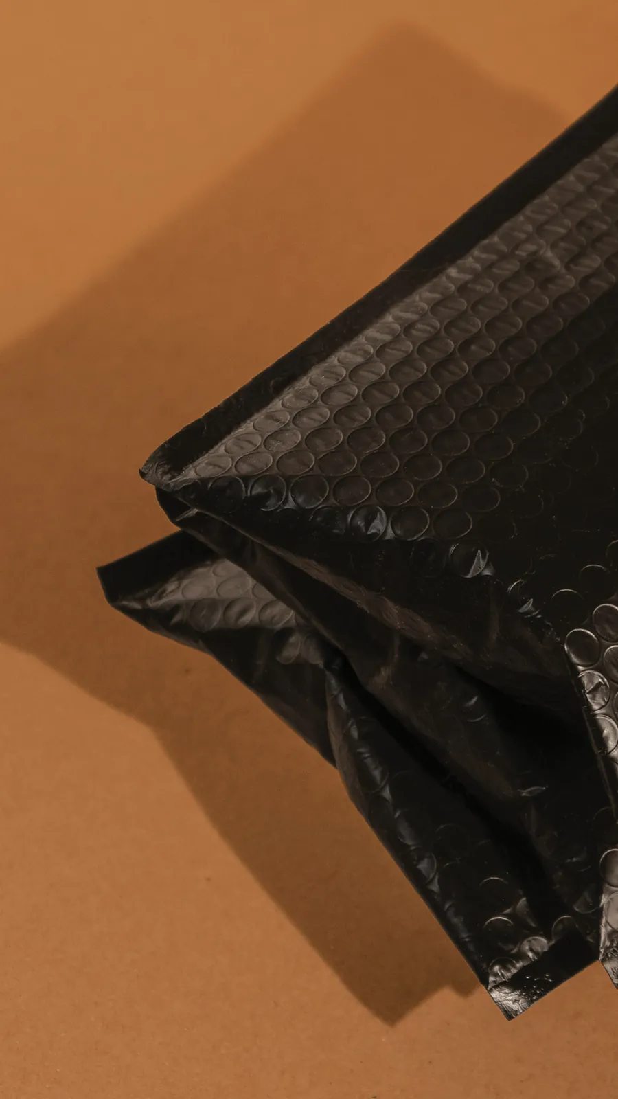 Black bubble mailer, close-up of the film face