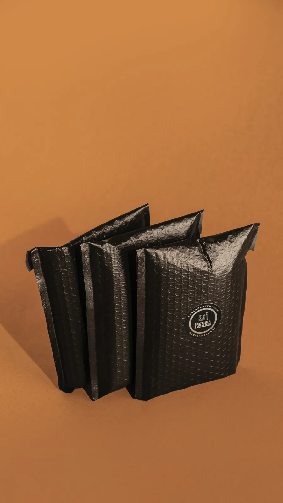 Black co-ex bubble mailers standing in a row